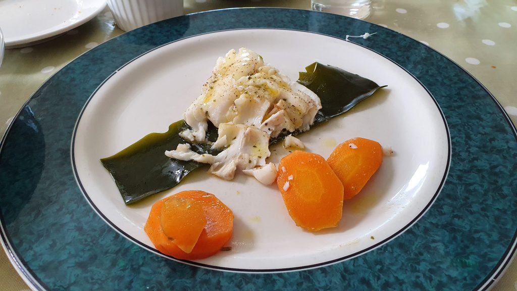 Cod steamed in kelp with butter-glazed carrots