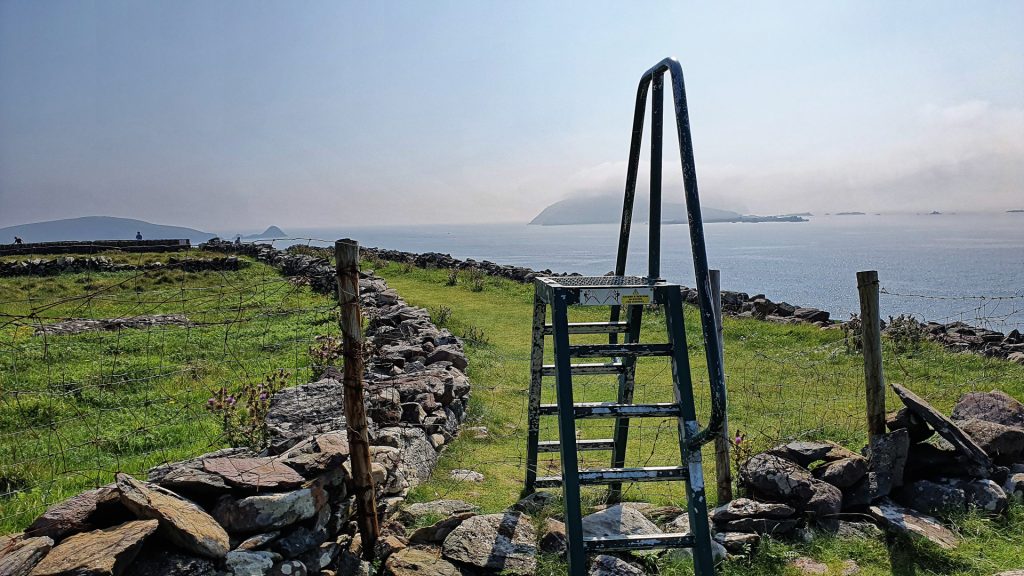 Stile over a fence looking out to the Blasket Islands