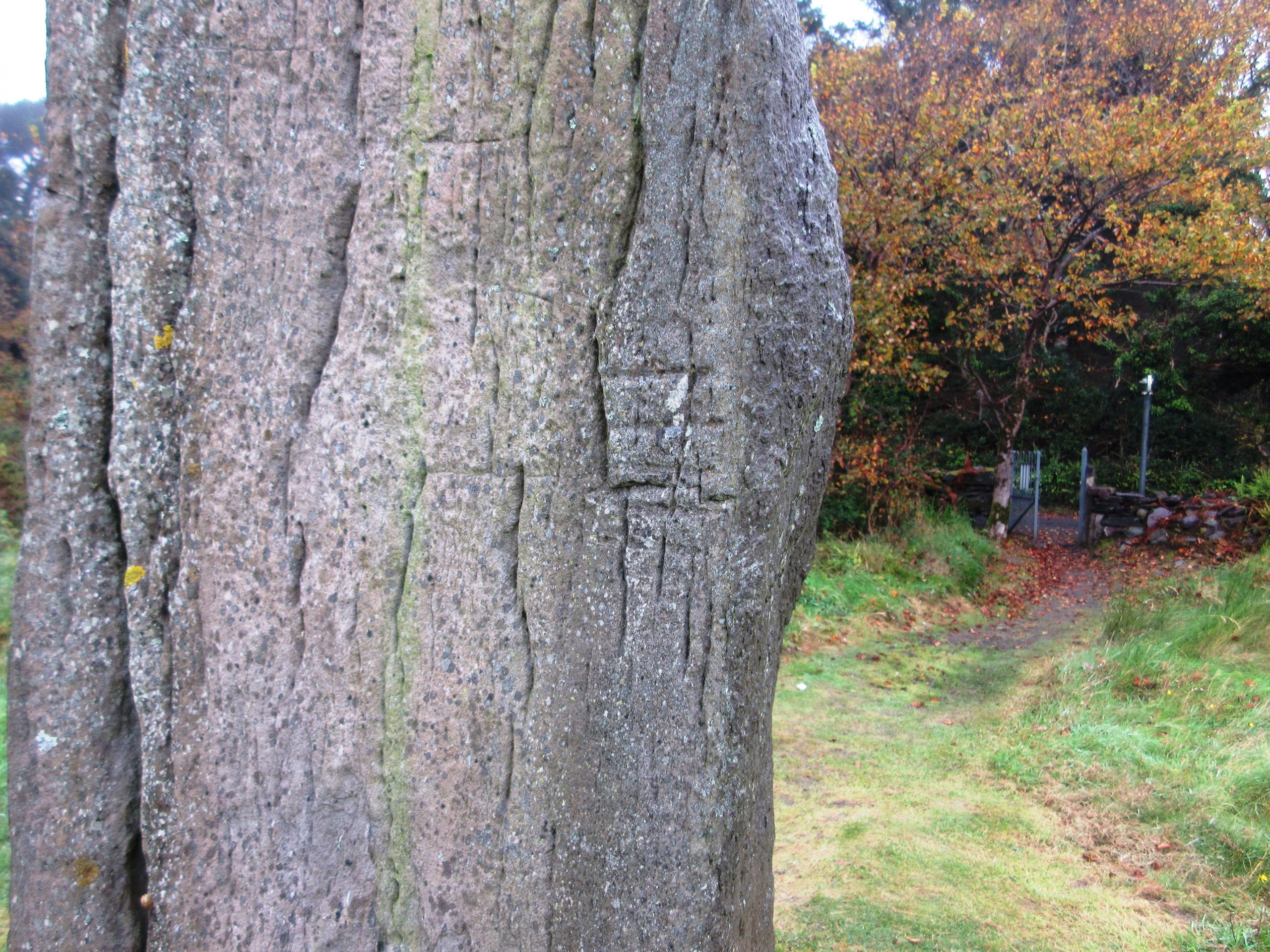 A close-up of Ogham writing on the Derrynane standing stone