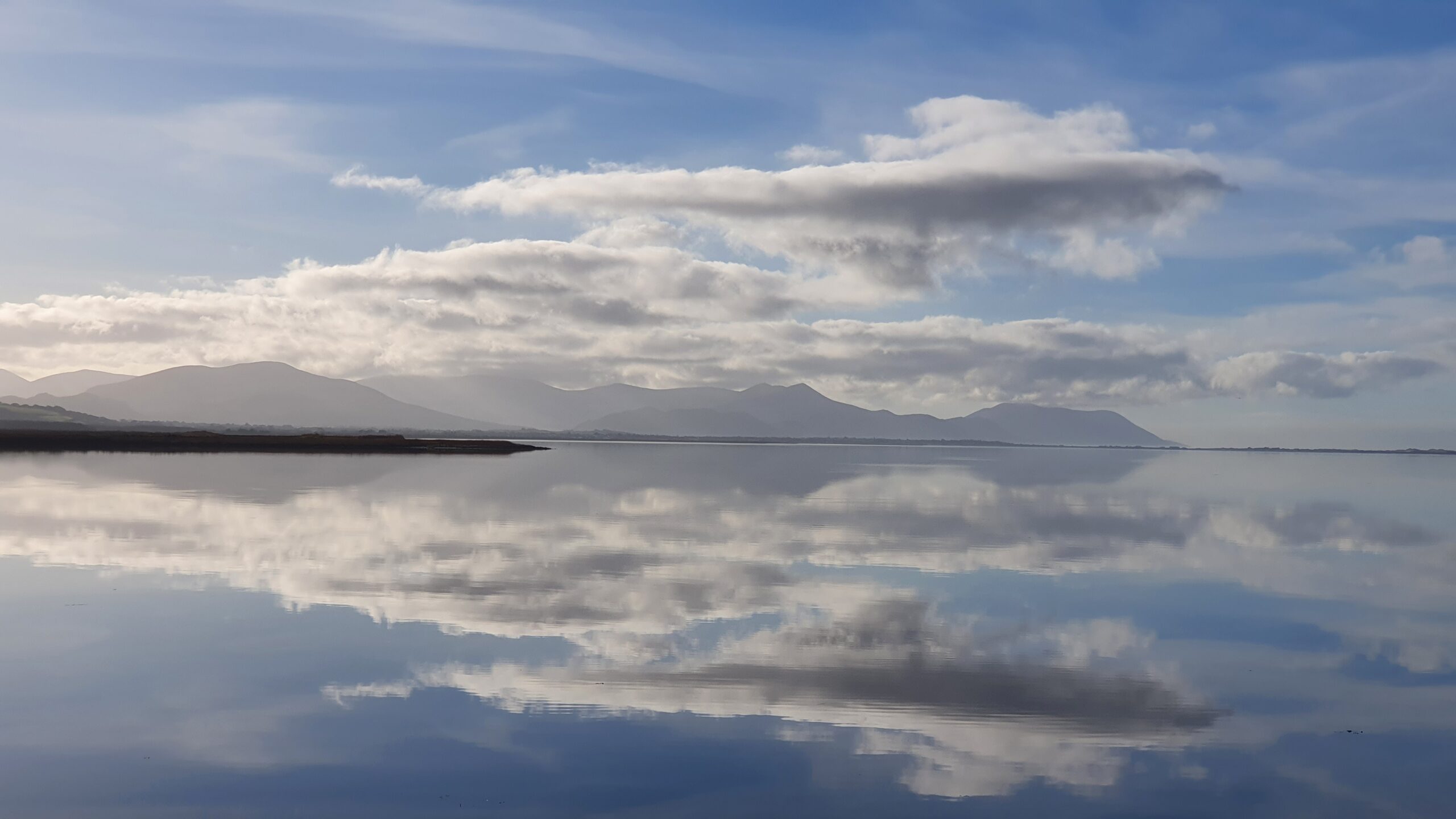 Reflections of the ever-changing skies and landscapes in the waters of Castlemaine Harbour 