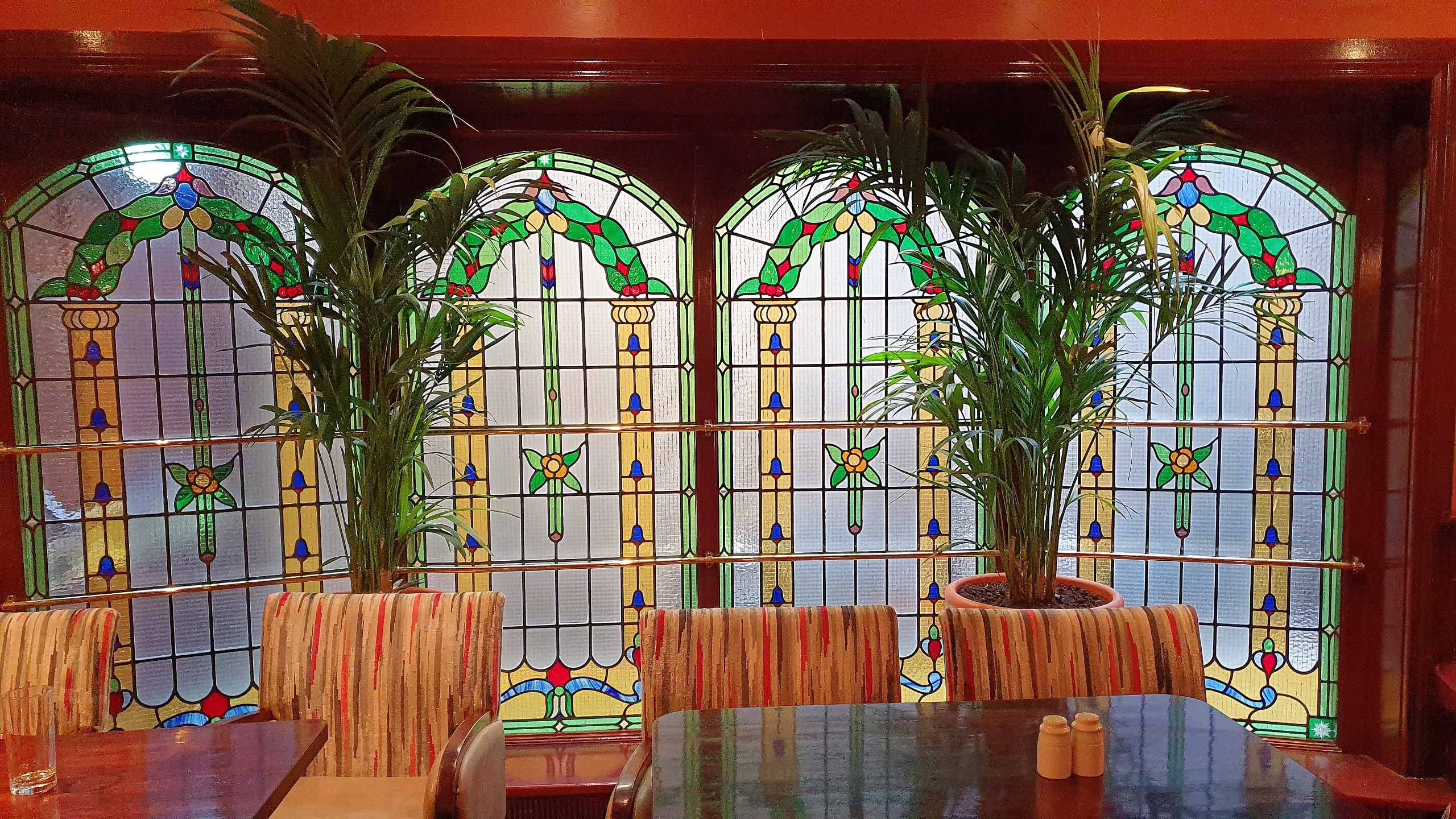 A stain glass window in the Thomas Francis Meagher Bar